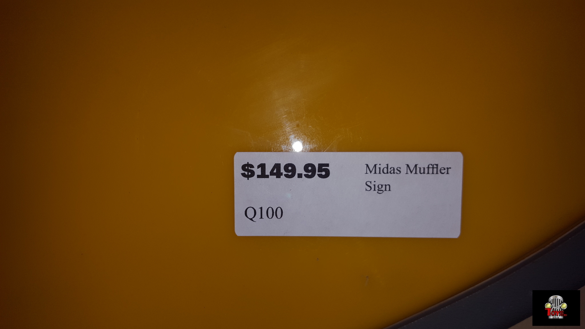 Midas Muffler Sign